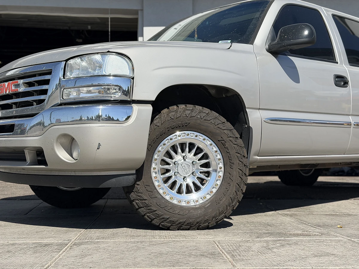 Machined with Clear Coat Lock Off-Road Grit Rim on 2003 GMC Sierra 1500