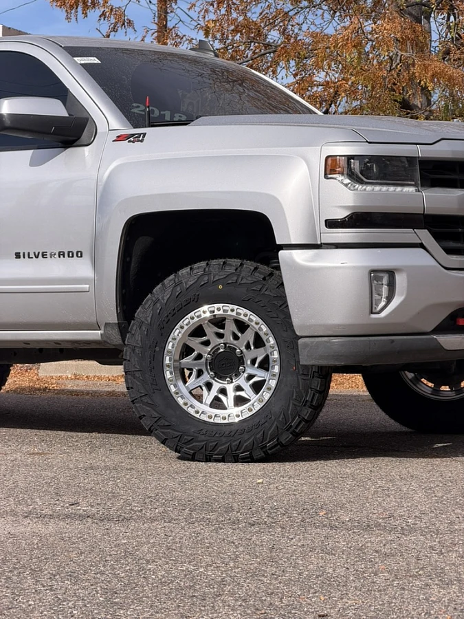 2017 Chevrolet Silverado 1500 with Polished Silver Lock Off-Road Lunatic Rims