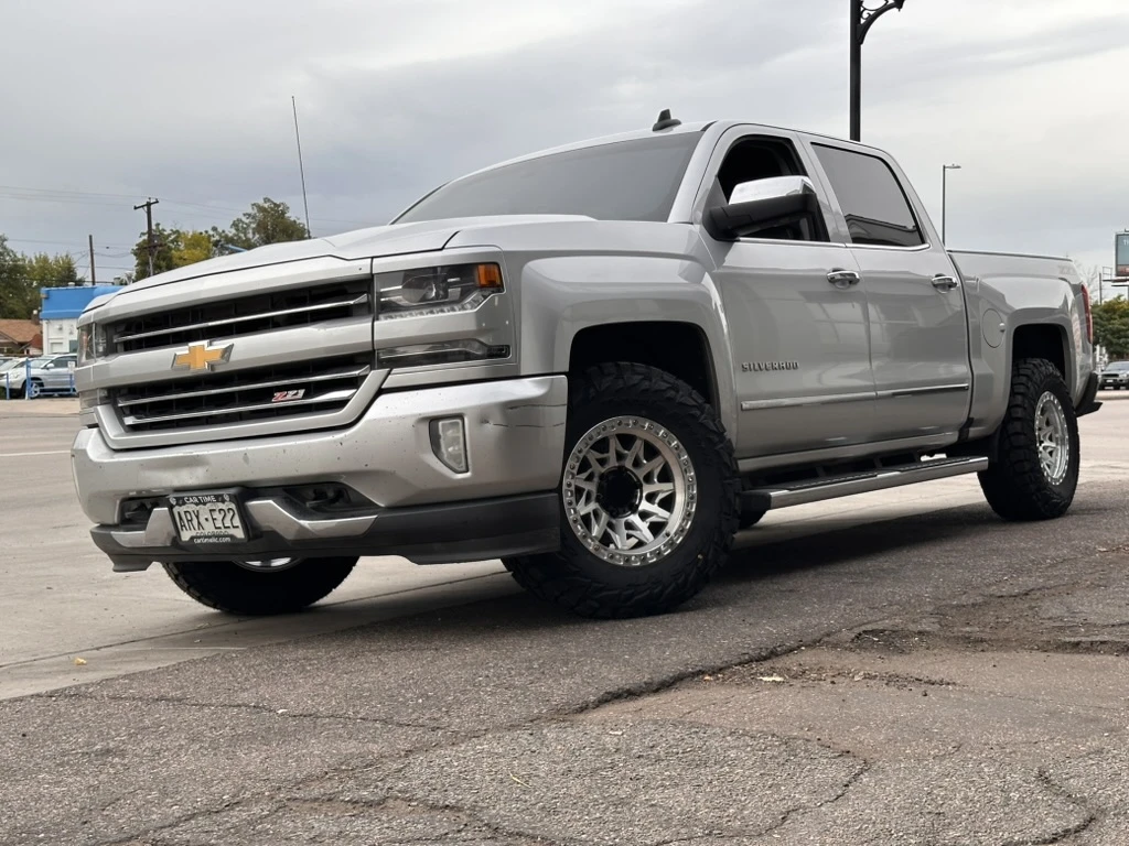 2018 Chevrolet Silverado 1500 with Polished Silver Lock Off-Road Lunatic Rims