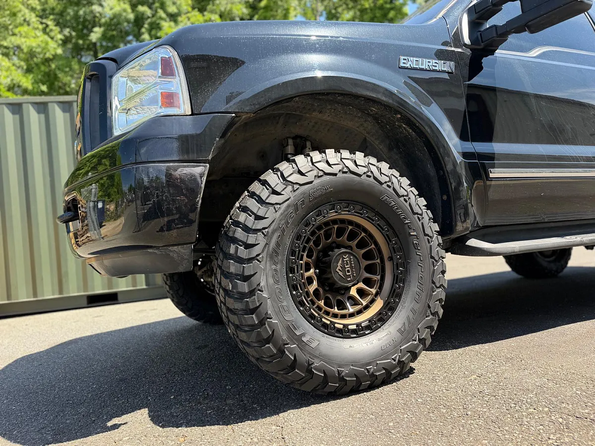 2005 Ford Excursion with Bronze Lock Off-Road Mojave Rims