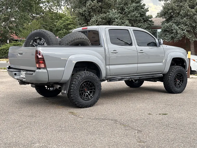 2014 Toyota Tacoma with Black Replica Wheels 17" TRD Pro 305 Rims