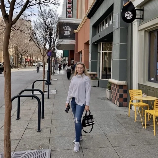 Margarita, also known as Puma, Accounting and remote marketing team member at Platinum Wheels and Tires, walking downtown